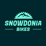 Electric mountain bike riding through the beautiful, pine-sheltered trails of Gwydir Forest in Snowdonia, North Wales