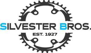 showroom featuring electric bikes, gravel bikes, and workshop repair stations at Silvester Brothers Cycles in Farnborough.